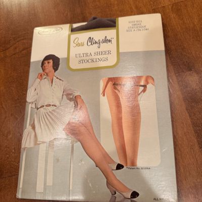 Woman’s 1960ies vintage sears cling on ultra sheer stockings